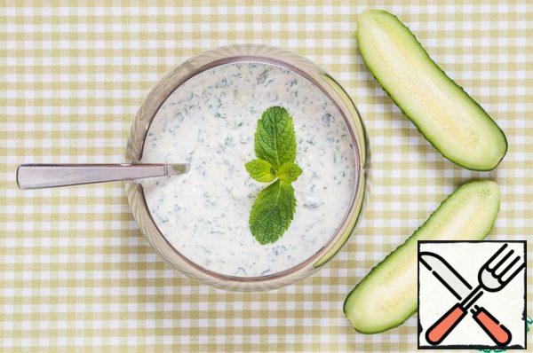 Prepared mint and cucumber mix with sour cream, salt, add 3-4 cloves of garlic for sharpness, squeezed through a garlic press. Olive oil can be added if desired.