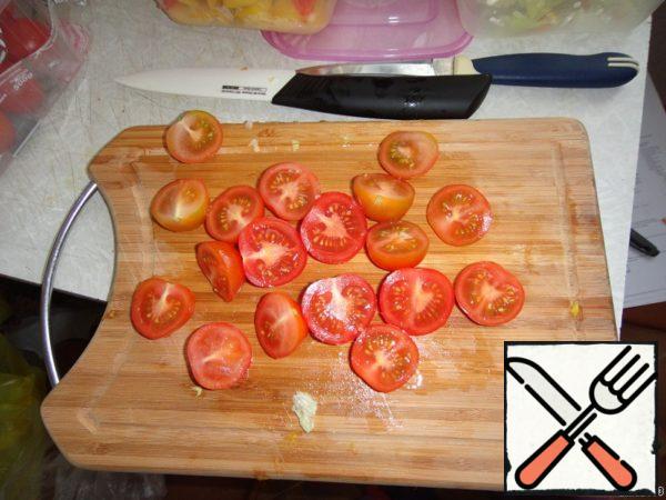 Tomatoes cut on halves of.