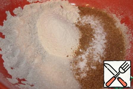 In a deep bowl, mix the sifted flour (and rye, and wheat), baking soda, salt, sugar and bran.