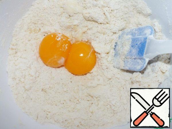 Add egg yolks.