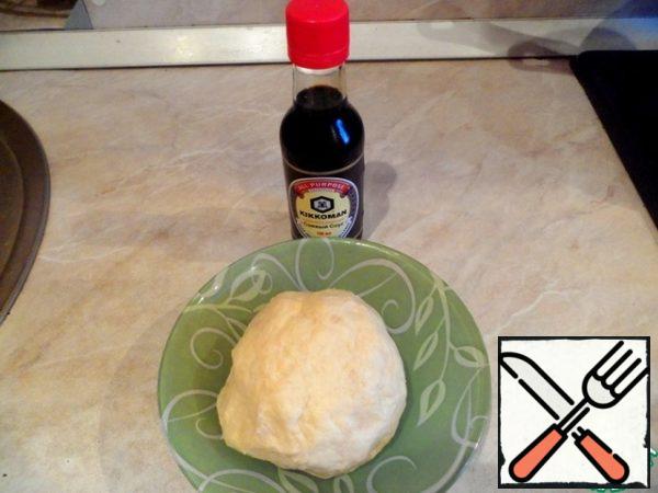 Mix dough from sour cream, cold butter, flour and soy sauce. Roll in a ball and put in the refrigerator for 1 hour.
