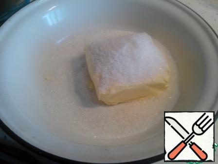 Grind butter and margarine with salt and sugar.