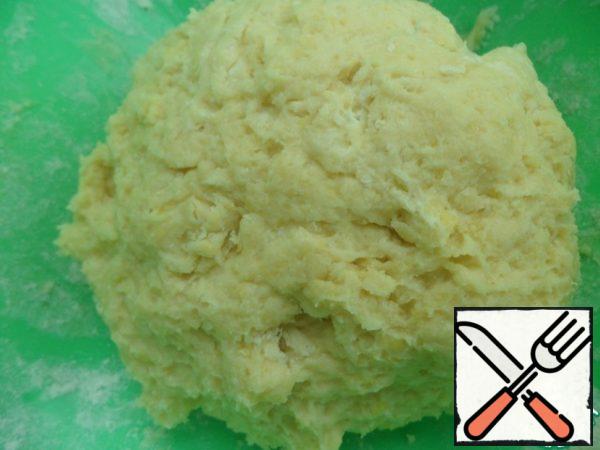 Prepare the dough-mix cottage cheese with yolk, sugar, milk and vegetable oil. Add flour and baking powder, knead the soft dough.