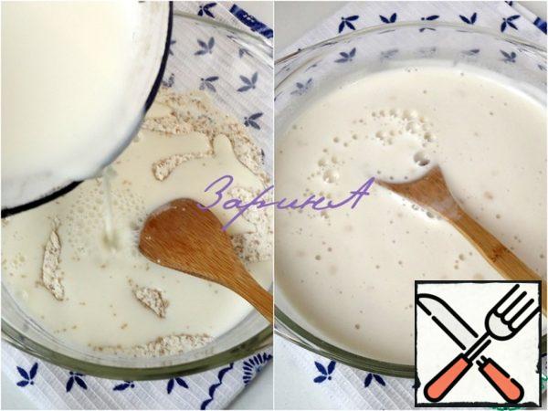 Yeast (I took 5 gr., it is 1 tsp) mix with a couple of tablespoons of flour and 1 tablespoon of sugar, heat the milk and add in to the dry ingredients. Stir and let them activate.