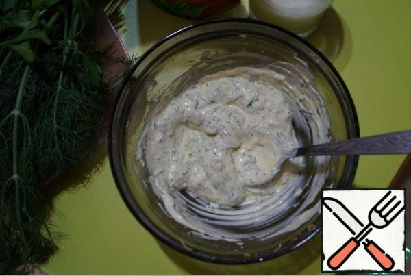 Finely chop the garlic and rub it into a pulp with 1 tsp salt, add pepper and mustard powder, mix well. Finely chopped herbs add garlic to the mixture, also add mayonnaise and juice of the remaining half of a lemon. Pour in as much whey as necessary to obtain the desired consistency of the sauce.
