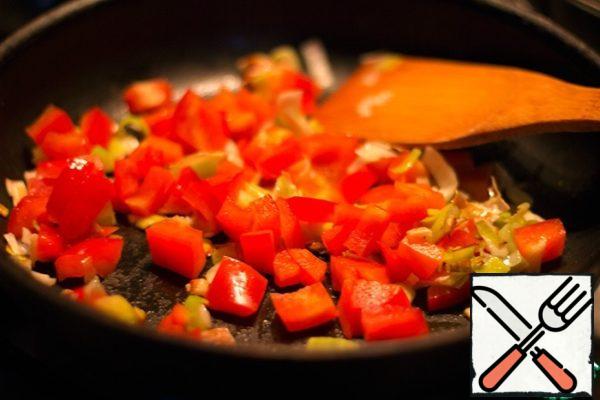Add chopped red bell pepper. Pour the wine. Cook for 5 minutes, stirring occasionally.