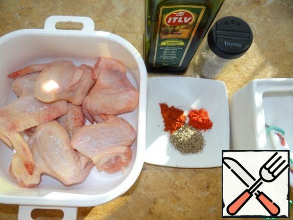 Dry seasonings mix together;Salt the wings, sprinkle with seasonings, drizzle with oil;Rub  the marinade into the meat and leave for 15 minutes;