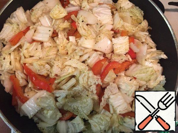 Add the cabbage and fry for 1 minute.
