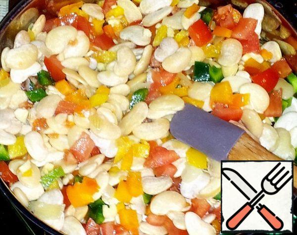 Cook the beans on low heat for at least 1.5 hours. Do not forget to stir the contents of the pan occasionally.
