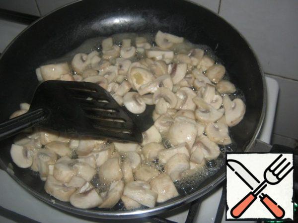 Fry mushrooms in olive oil for two minutes.