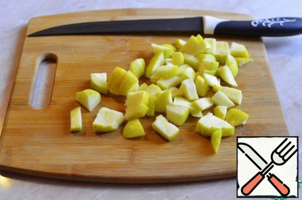 Cut the apple (not peeled) into cubes.
