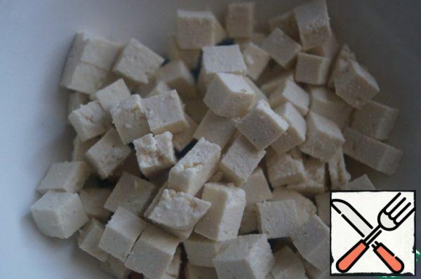Tofu cut into small cubes.