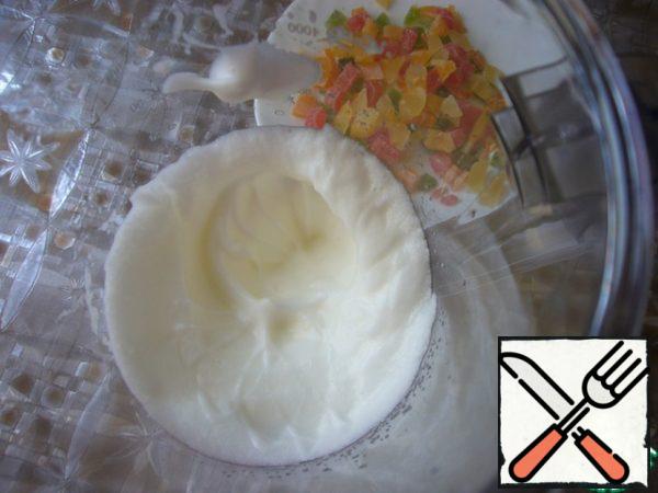 Egg whites whisk in a cool foam (before whipping add a pinch of salt), candied fruit finely cut.