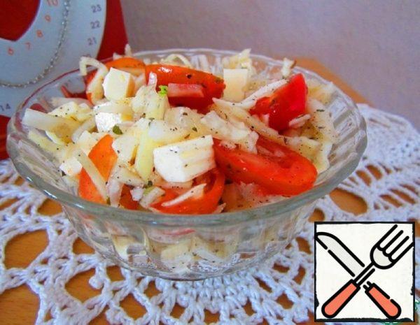 Mix cabbage, tomatoes, spices, garlic, add cheese, season with vegetable and salad is ready.