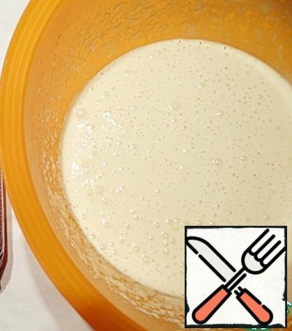 Beat eggs with a mixer for about two minutes, then gradually, literally one tablespoon, add brown sugar, continuing to whisk (in total, whisk for about 5-6 minutes).