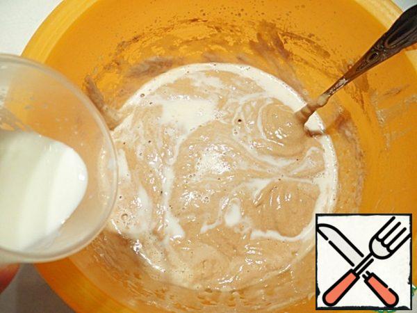 Gradually add just boiled milk (I heat it in the microwave), constantly stirring the dough with movements from top to bottom.