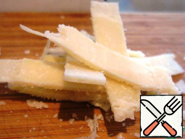 Grate the cheese thin slices.