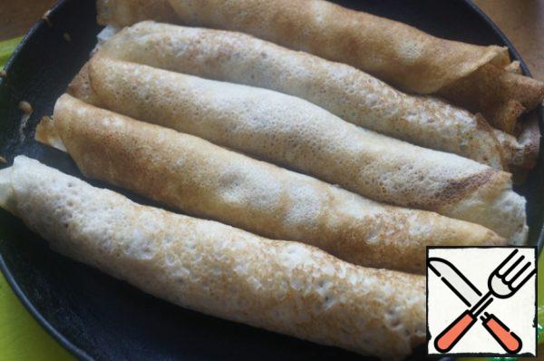 Roll up a tight roll. Do this with all the pancakes.
