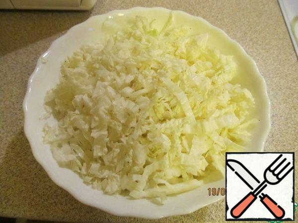 Chop the cabbage and add salt.
