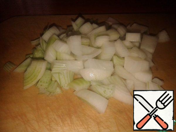 While the meat is stewing, peel and dice two large onions.

