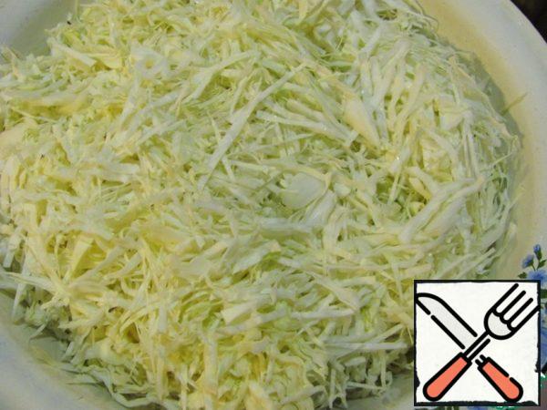 Chop the cabbage and put it in a large bowl.
