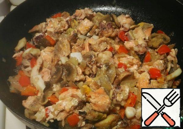 ... seafood and salmon fillets. Fry for about three minutes.

