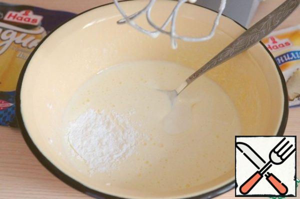 Add baking powder (10 g) to the beaten egg yolks. Add a pack of vanilla.
