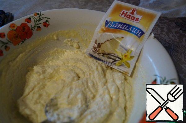 Rub the cheese through a sieve.
Add the yolks, sugar, vanilla, and whisk until smooth. Add the lemon zest and stir.