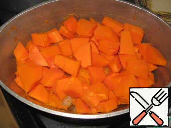 After 5 minutes, add the diced pumpkin (naturally washed and cleansed of skin and seeds.