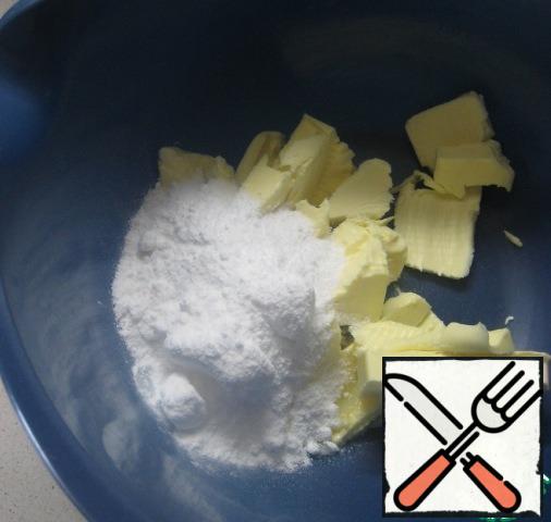 Soft butter combine with powdered sugar and beat with a mixer until light.