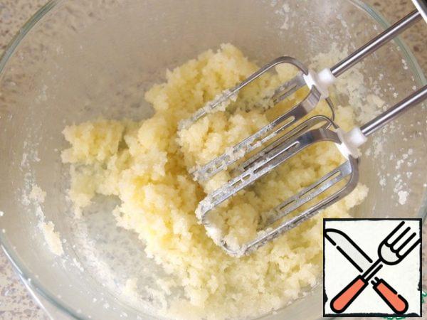 With a mixer beat softened butter and sugar to a cream.
