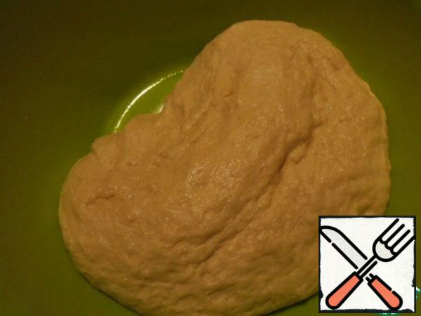 In "animated" yeast, add the egg and whisk. Add the sugar, the zest from one lemon, salt, warm milk, sour cream. Mix well, add flour, first 2.5 cups, knead the dough. Add the softened plums. oil. If necessary, add a little more flour, but do not rush. Kneading the dough, add vegetable oil. The dough turned out soft, obedient, comes from the hands, elastic. Cover it and leave in a warm place to approach, 30-40 minutes.
