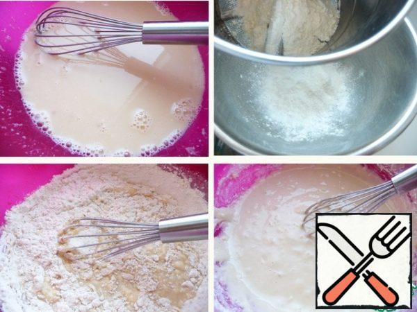 Mix well.
Mix starch with baking powder, add sifted flour.
The flour is introduced into the mixture in parts, mixing thoroughly so that there are no lumps.