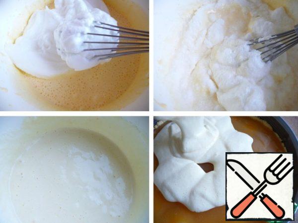 Add the egg whites to the yolks, mix with a whisk from the bottom up.
Pour the baked cake and continue baking at the same temperature for another 30-40 minutes. (watch your oven.) If the top starts to burn, cover the pie with foil.
