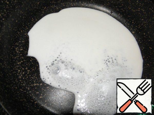 A small pan rinse with cold water, pour milk into it and bring to a boil.