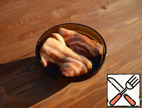 While the grill is warming up, marinate the bacon in soy sauce for 10-20 minutes.
