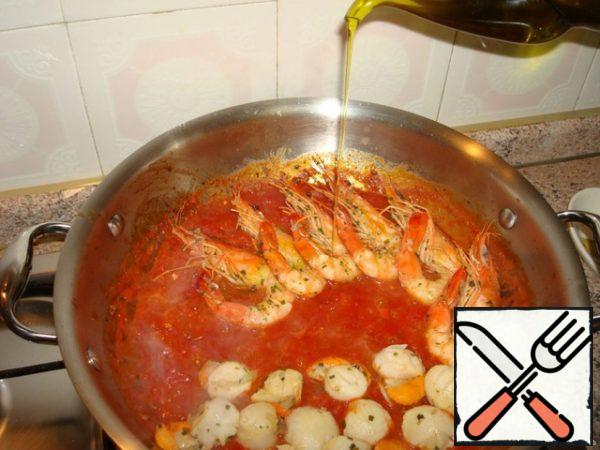 Then put on top of seafood, add some more olive oil, a little pepper and salt, simmer all together for another 5-7 minutes