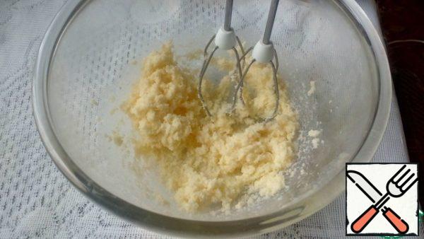 Beat the softened butter with sugar.