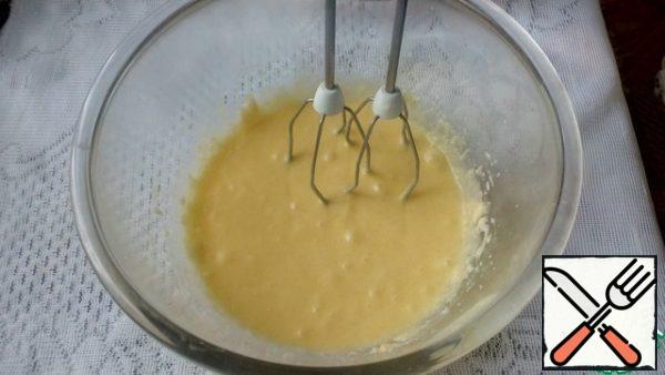 Add the eggs one by one whisking after each addition.