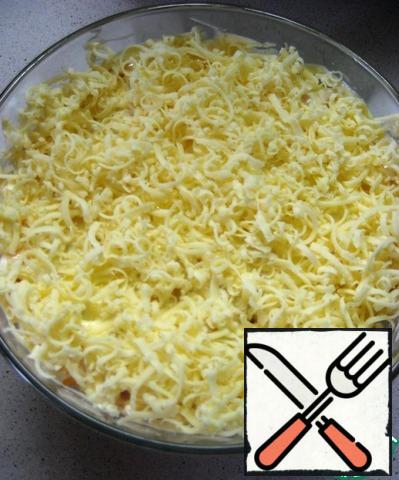 6. The final layer is grated hard cheese.