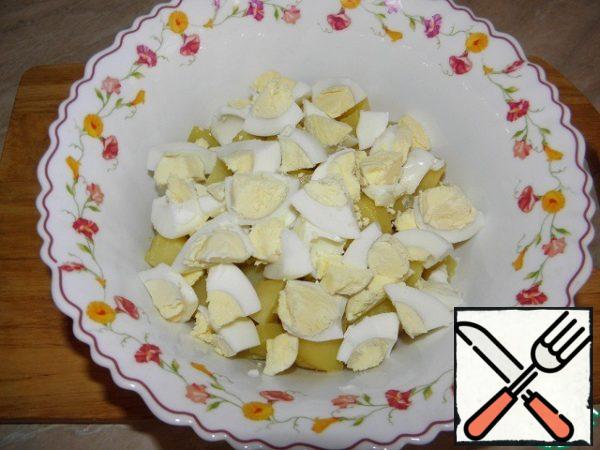 The eggs boil, chop and add to potatoes.