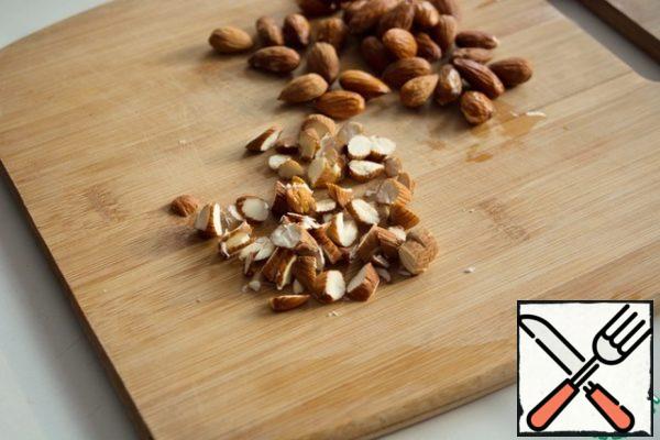 Almonds chop with a knife randomly.