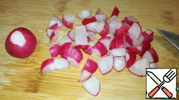 Cut the radish into cubes and send it to a bowl with the fifth layer.
