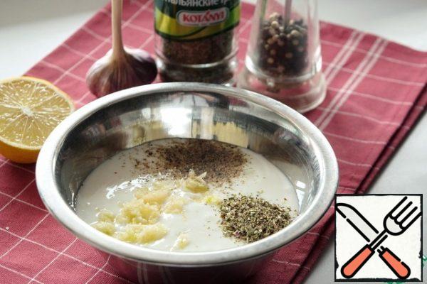 I use homemade yogurt, it's pretty thick. If the yogurt seems watery to you, throw it on a sieve through a triple layer of gauze for 20-30 minutes, excess whey will drain. You can also use low-fat sour cream.
Add ground black pepper, garlic crushed through a press and Italian herbs to the yogurt.