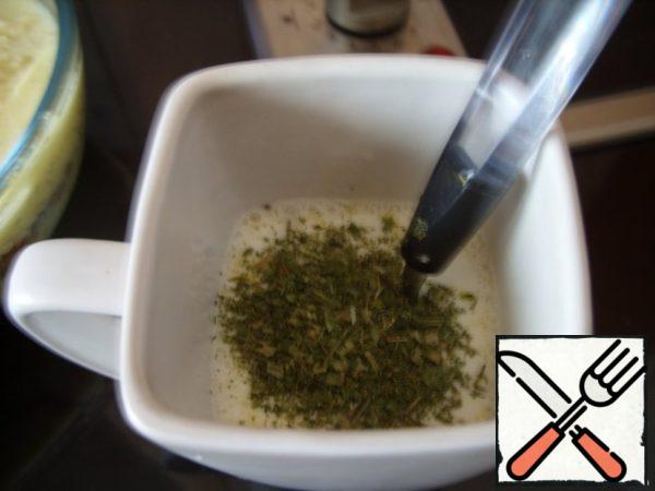 Next - the remains of mashed potatoes.
Now prepare the sauce: break 2 eggs into a glass, pour in milk, add herbs, mix thoroughly.