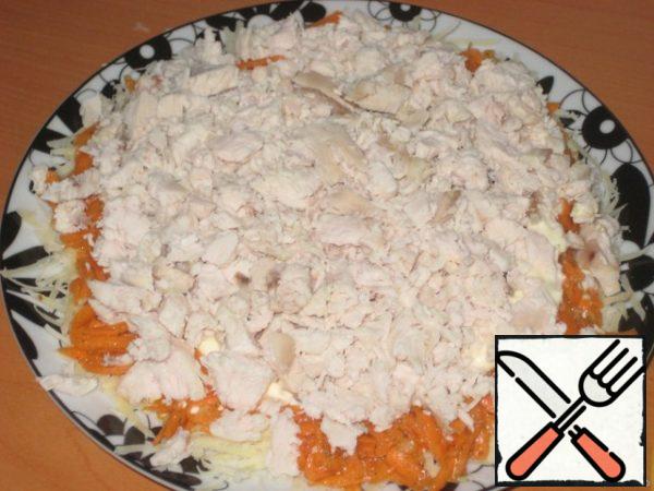 The third layer is boiled chicken breast, diced.
