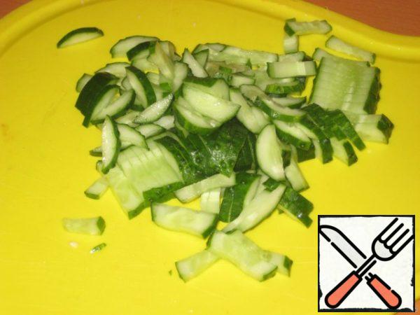 Cut cucumbers into strips.
