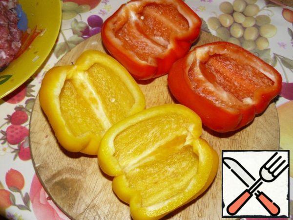 Sweet Bulgarian pepper cut into two halves and peel from the seeds.
