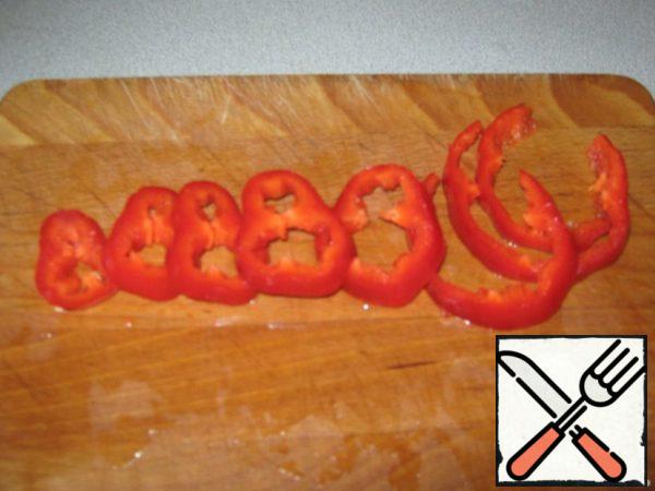 Wash, peel, and slice the pepper.
