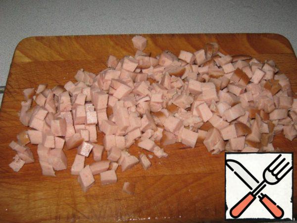 Ham or sausage (to taste and if possible) cut into cubes.

